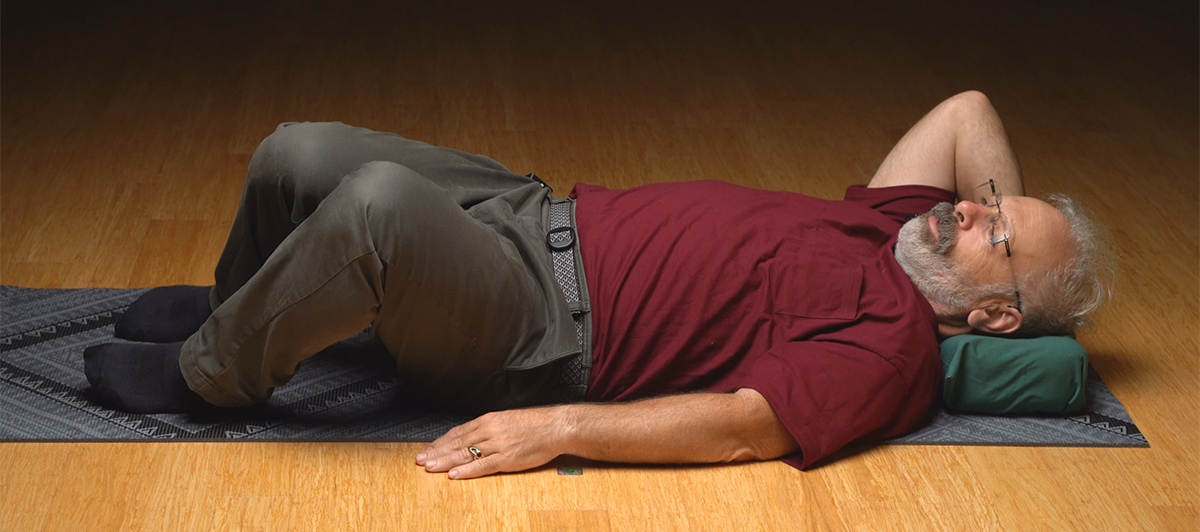 Image of Eric Cooper Lying down doing Gentle Somatics